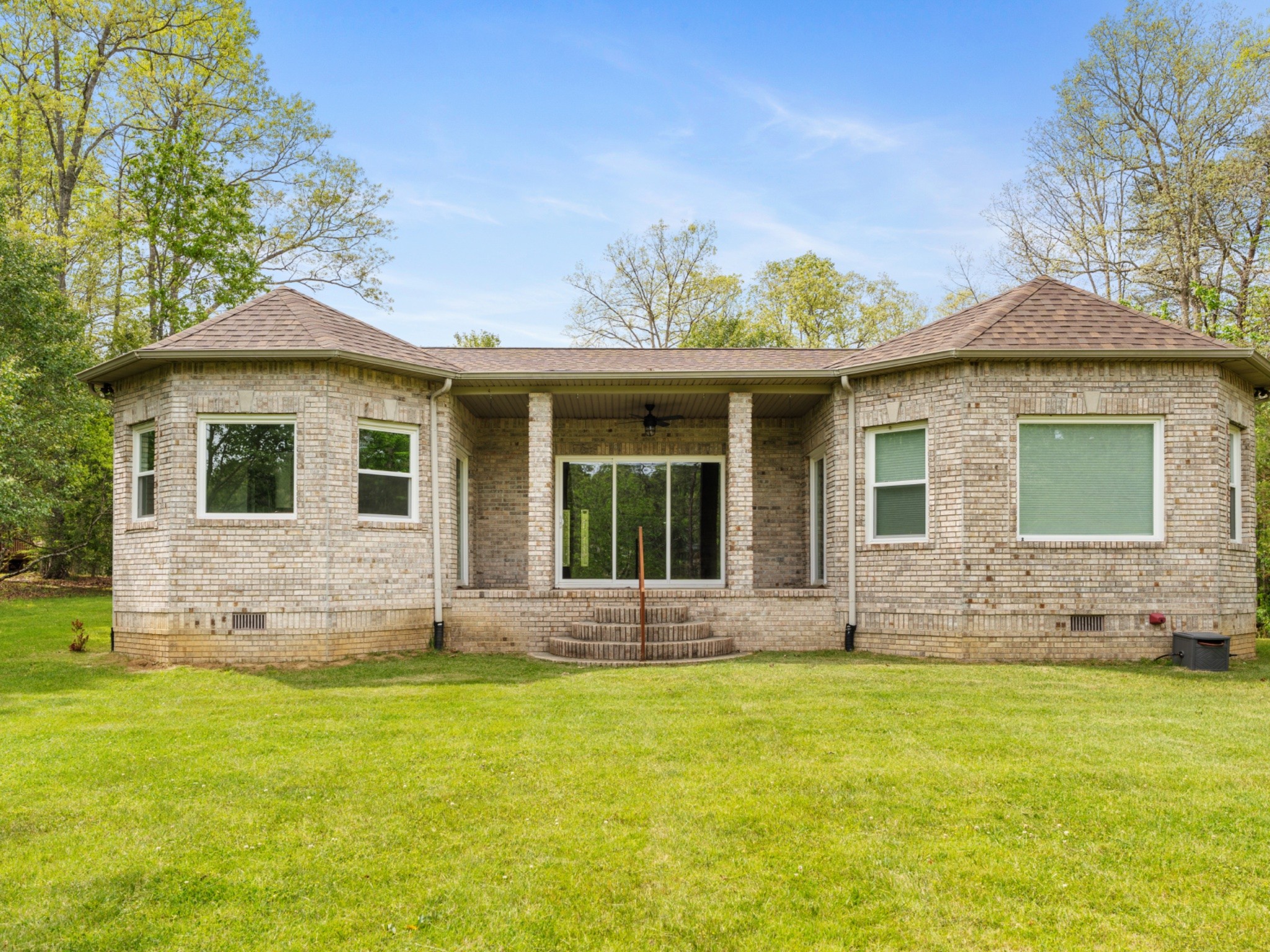 374 Eagle Lake Road Coalmont, TN 37313 - Photo 2 of 47 a front view of a house with a garden and yard