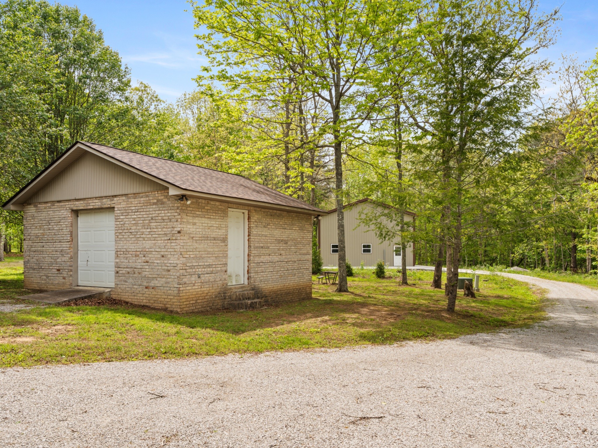 374 Eagle Lake Road Coalmont, TN 37313 - Photo 37 of 47 a view of a house with a yard and garage