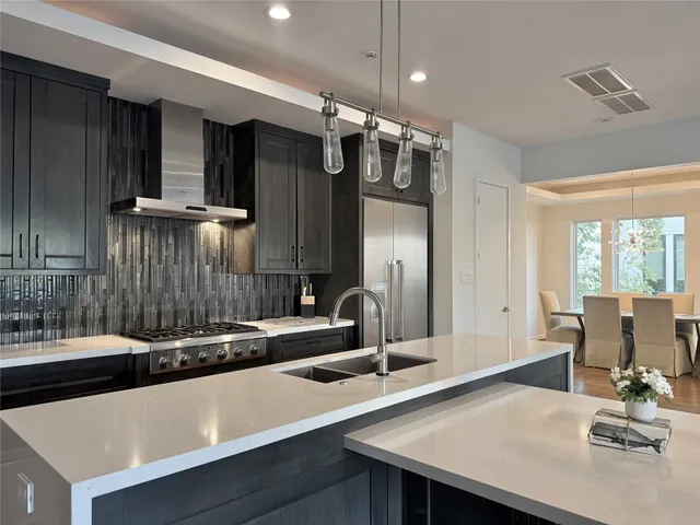 a kitchen with a sink and a refrigerator