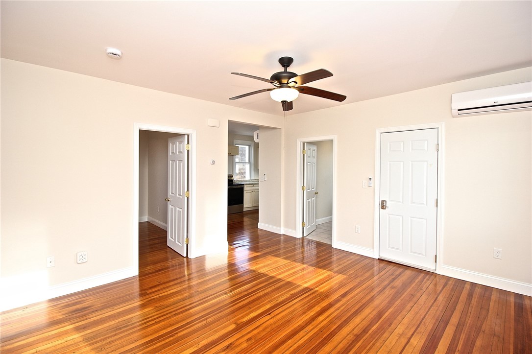 668 Thames Street, Unit 2 Newport, RI 02840 - Photo 13 of 42 Entry view to living room, bedroom 2, kitchen and full bath and back door to back stairway.