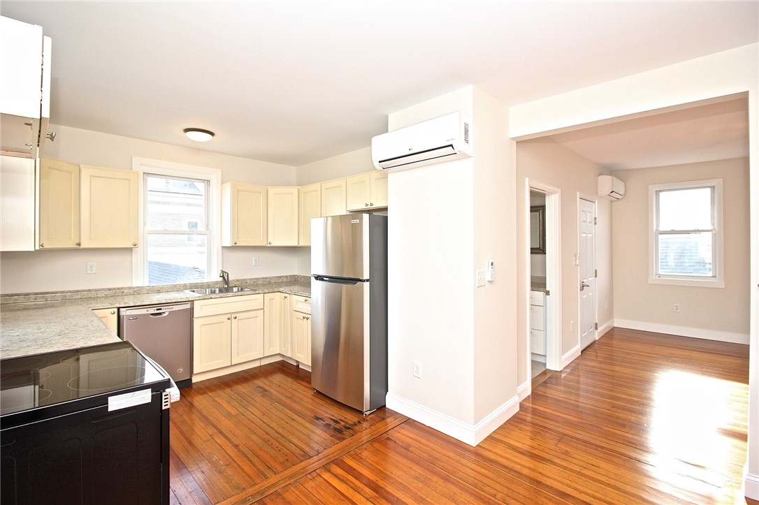 668 Thames Street, Unit 2 Newport, RI 02840 - Photo 16 of 42 Eat in Kitchen with new appliances view to living room and bathroom