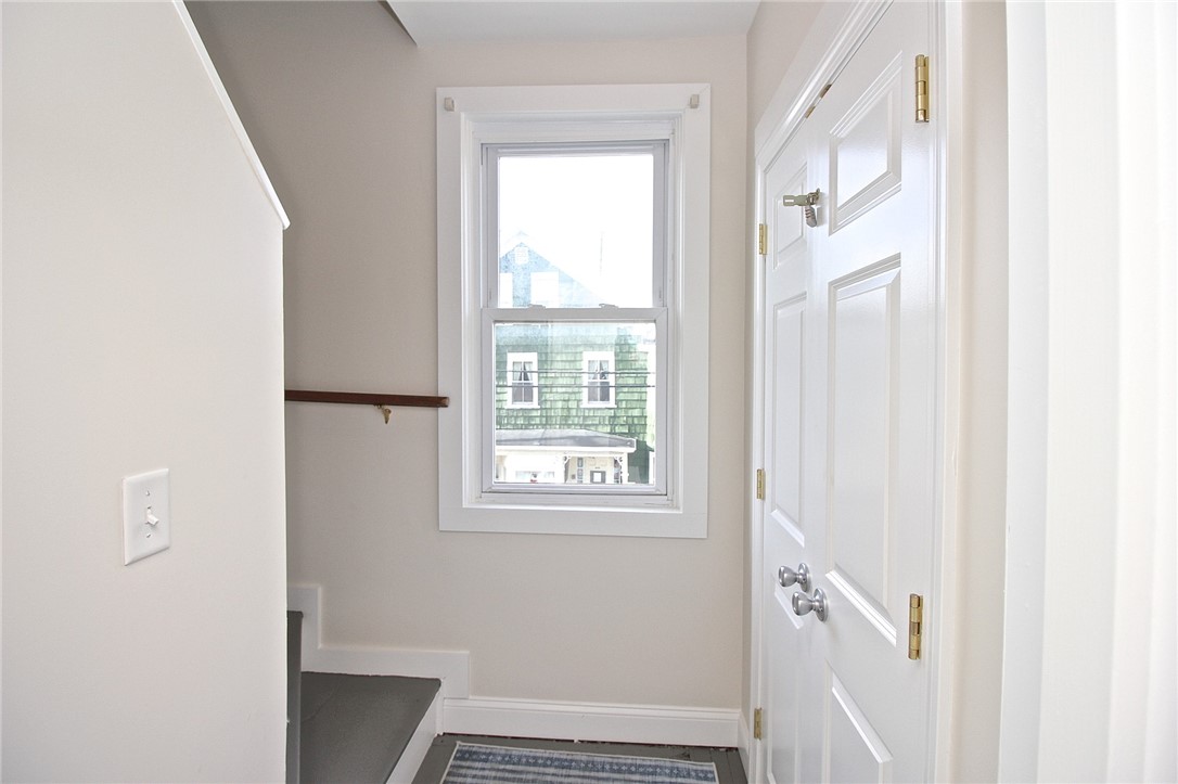 668 Thames Street, Unit 2 Newport, RI 02840 - Photo 31 of 42 Landing on 2nd floor view to stairs for 3rd floor