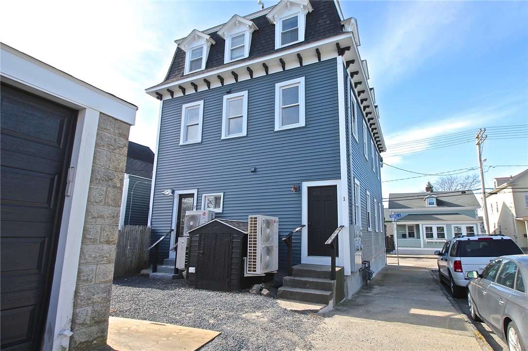 668 Thames Street, Unit 2 Newport, RI 02840 - Photo 34 of 42 Rear View from garage to private entry for 1st floor, bulkhead to basement and back door for apt 2&3