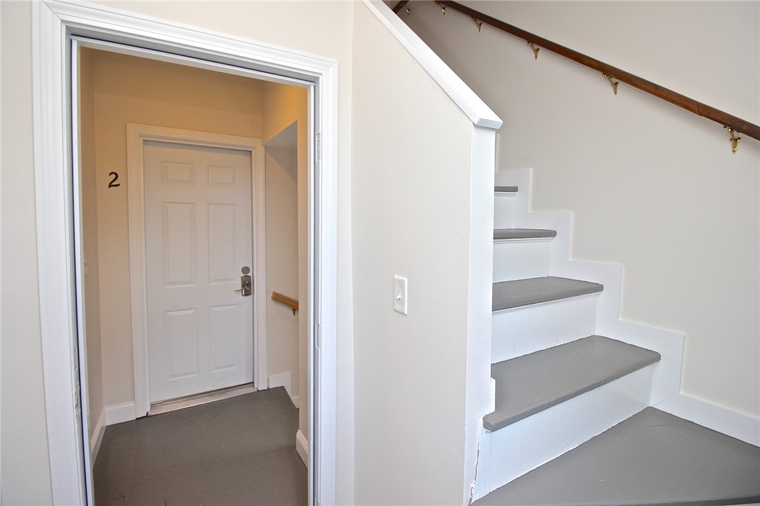 668 Thames Street, Unit 2 Newport, RI 02840 - Photo 10 of 42 Doorway and landing for apt 2 then view to stairway to apt 3