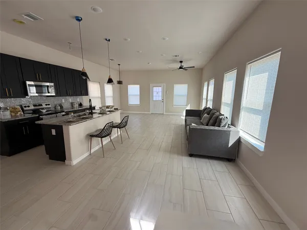 a white toilet sitting next to a bathroom sink