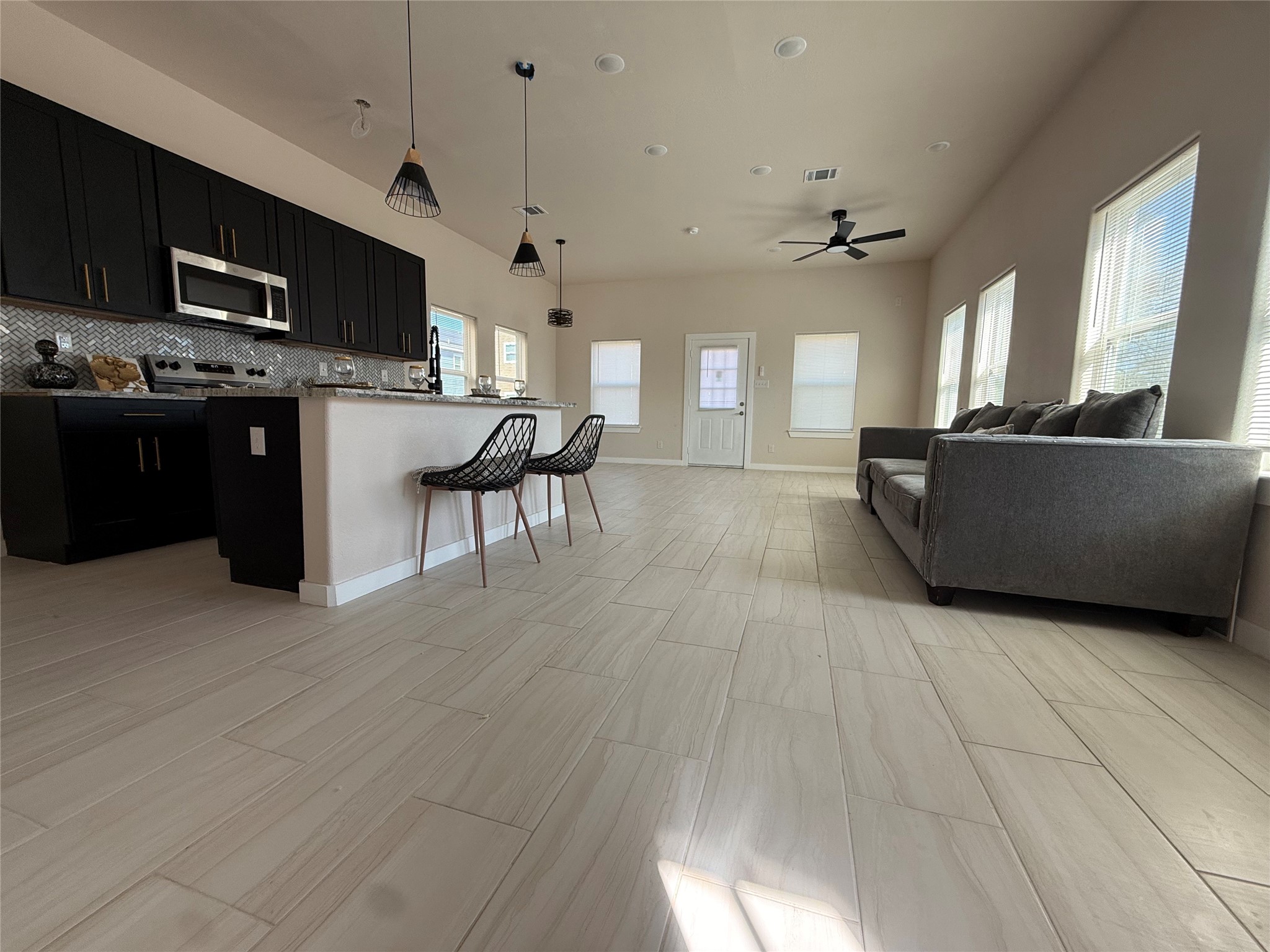 219 South 7th Street Beasley, TX 77417 - Photo 23 of 23 a living room with furniture and a flat screen tv