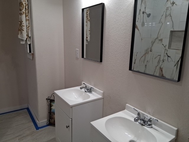 219 South 7th Street Beasley, TX 77417 - Photo 5 of 8 a bathroom with a sink and mirror