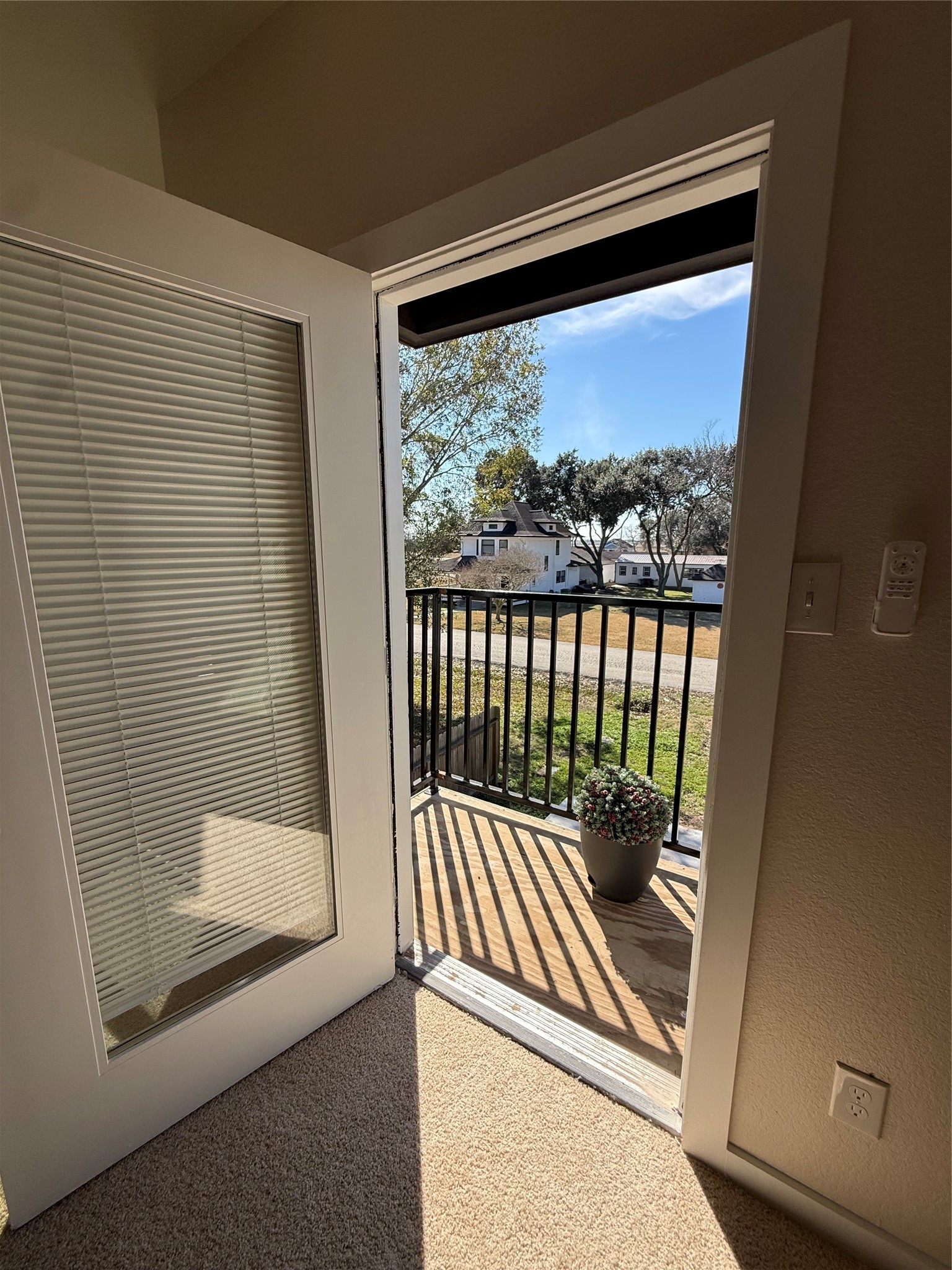 219 South 7th Street Beasley, TX 77417 - Photo 7 of 23 a view of a balcony with a door and wooden floor