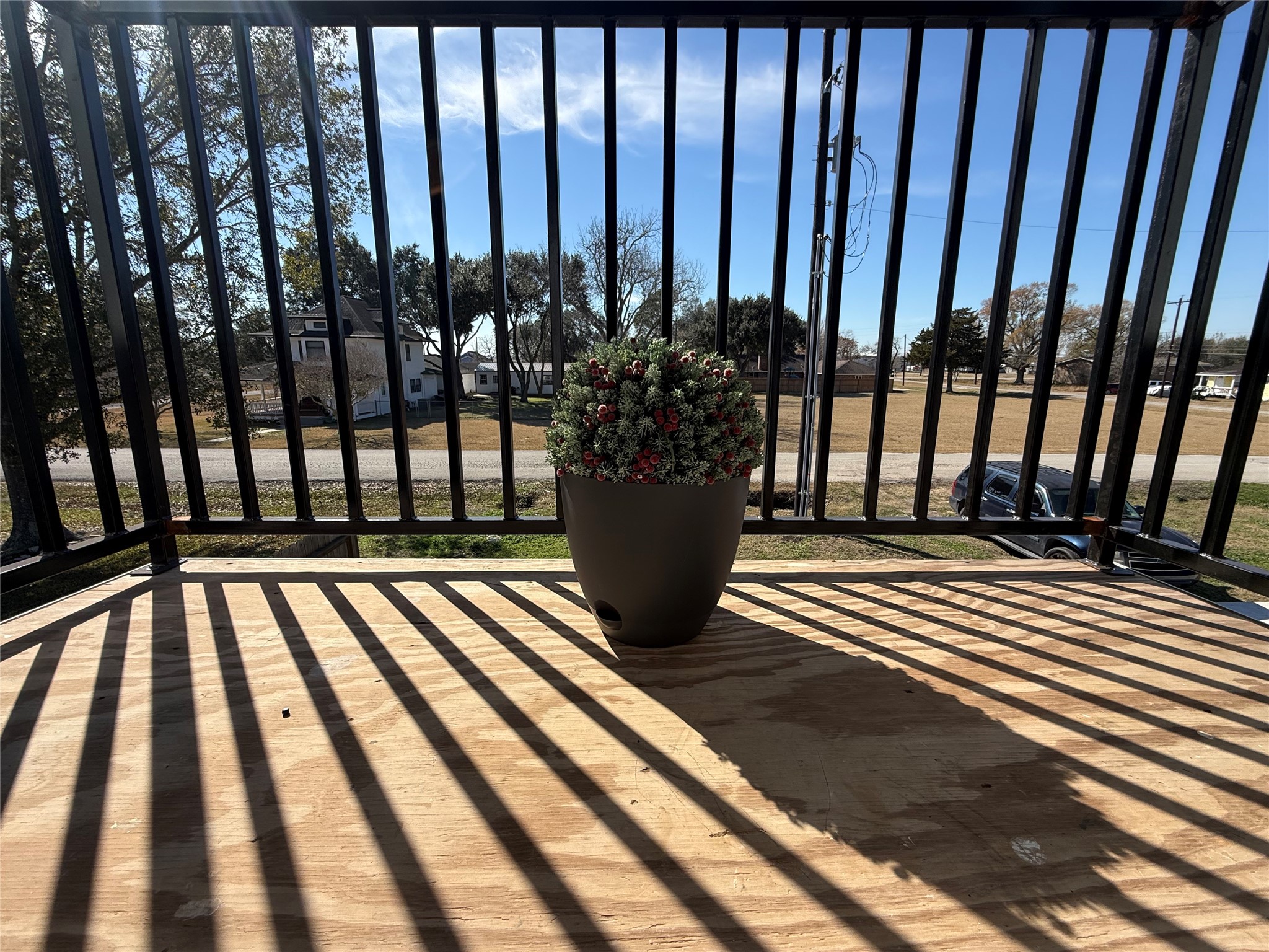 219 South 7th Street Beasley, TX 77417 - Photo 8 of 23 a view of a balcony with wooden floor and stairs