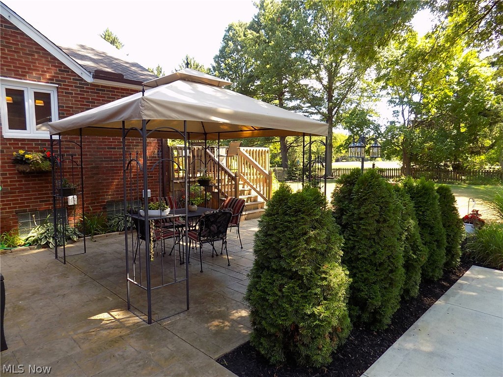 25769 Butternut Ridge Road North Olmsted, OH 44070 - Photo 23 of 35 Lovely & large stamped concrete patio with breathtaking views of the landscaped yard & Springvale Golf Course. Access door from patio to garage.