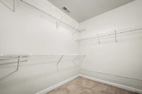 a view of a room with racks on the wall