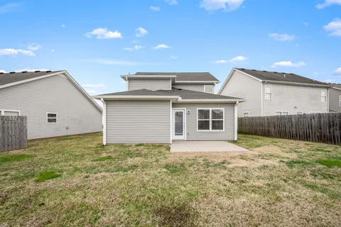 a view of a backyard of the house