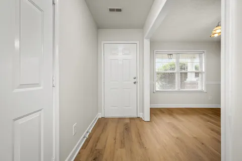 a view of wooden floor in an empty room