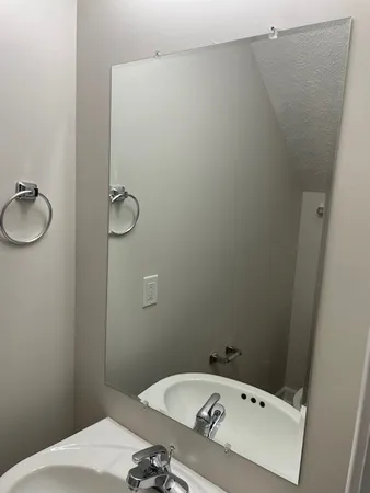 a bathroom with a sink and vanity