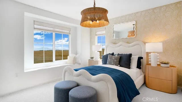 a bedroom with bed and a window