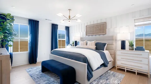 a bedroom with a large bed and a window