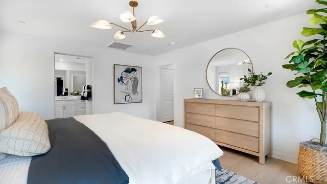 a bedroom with a bed and a dresser
