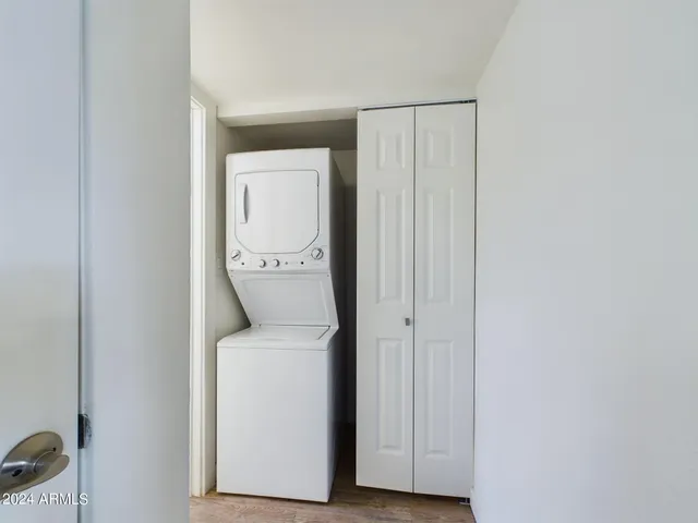 a utility room with a sink dryer and washer