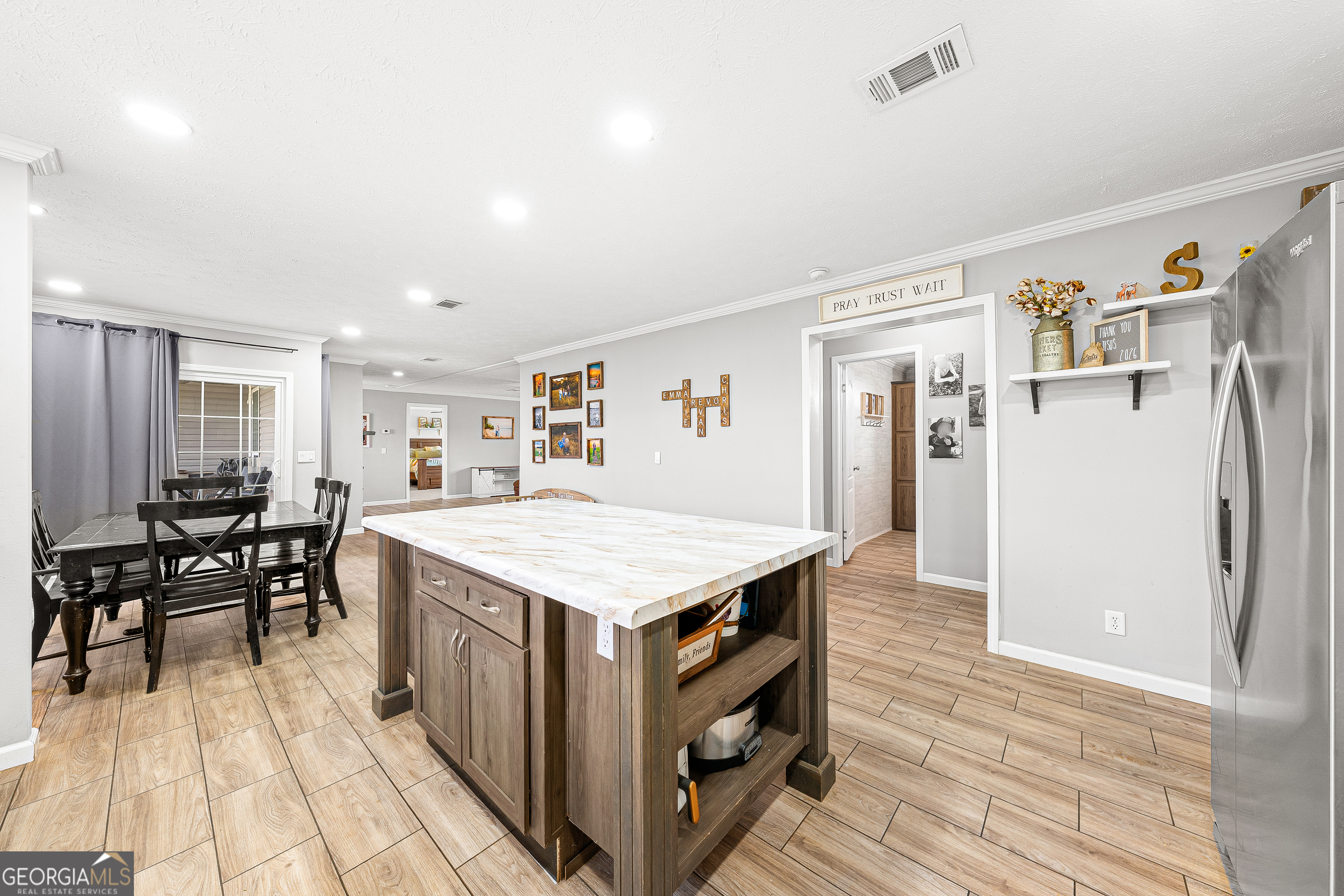 655 Lowe Road Comer, GA 30629 - Photo 9 of 19 a kitchen that has a table and chairs in it
