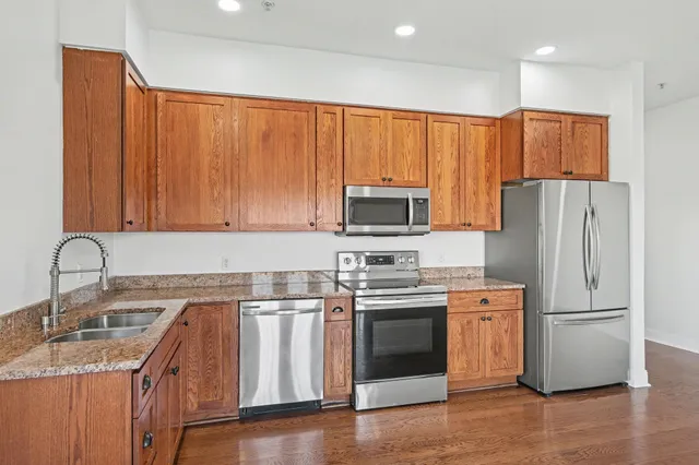 a kitchen with a sink and a granite top