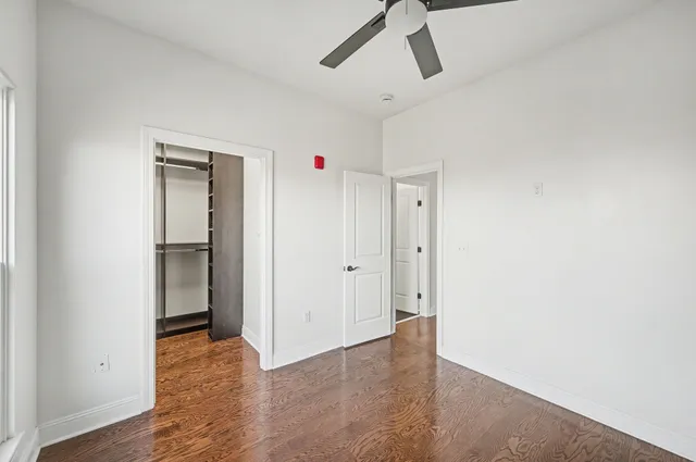 a view of an empty room with glass door