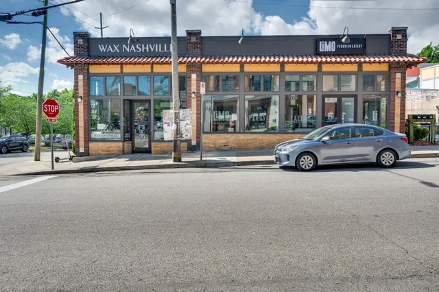 a view of a patio with table and chairs and potted plants
