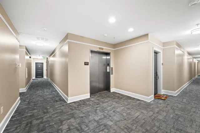 a view of hallway with livingroom