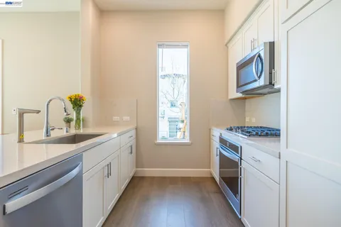 a kitchen with a stove and a refrigerator