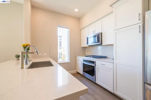 a bedroom with a bed chair and window