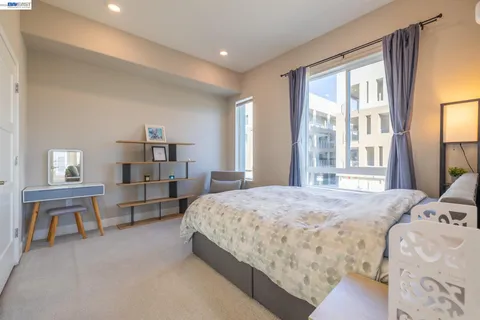 a bedroom with bed and window