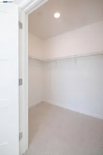 a bathroom with a double vanity sink toilet mirror and shower