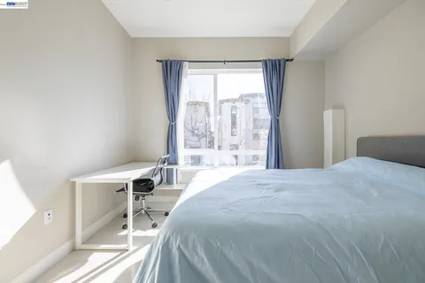 a bedroom with a bed and a table