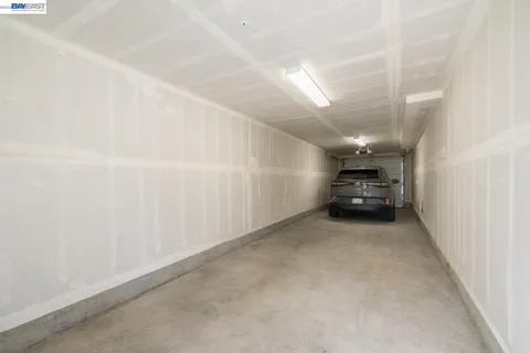 a view of a staircase with white walls
