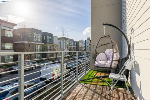 a view of balcony with wooden floor