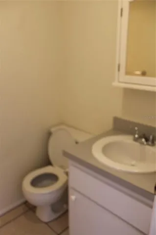a bathroom with a toilet and a sink