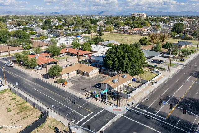 an aerial view of a residential houses with outdoor space