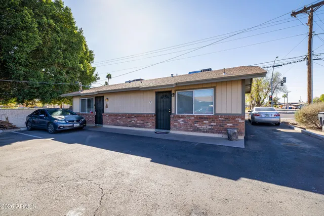 a view of a car park in front of house