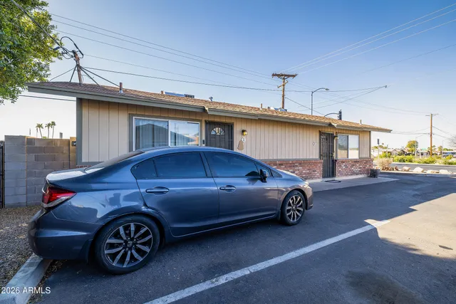 a car parked in front of a house