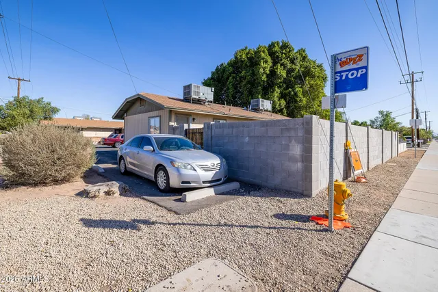 a front view of a house with parking space