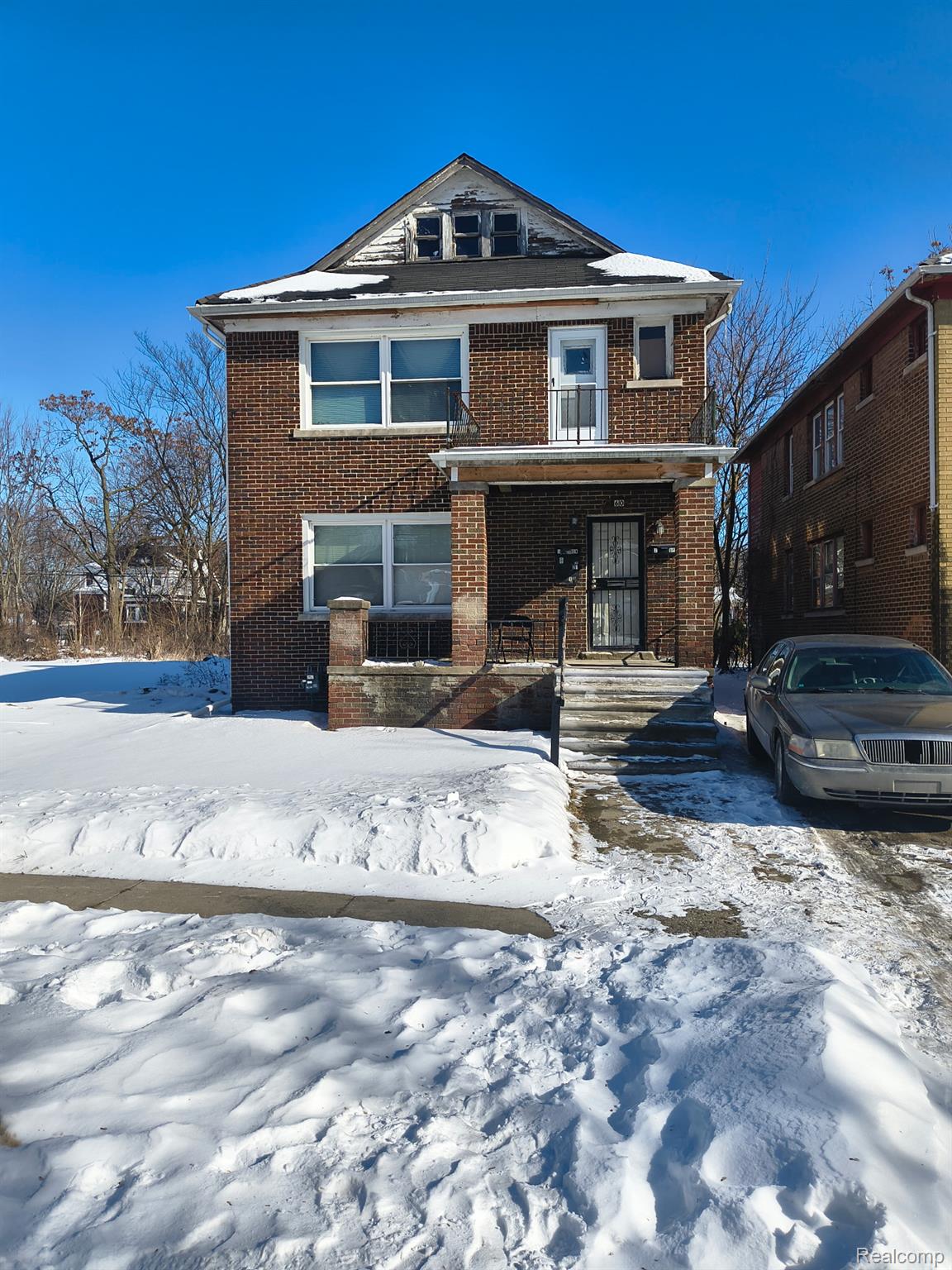 View of front of property featuring brick siding