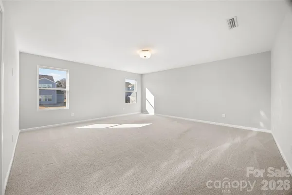 an empty room with a empty space and window