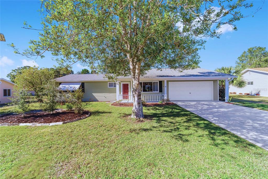 11436 Southwest 84th Court Road Ocala, FL 34481 - Photo 1 of 1 a view of a house with a yard and large tree