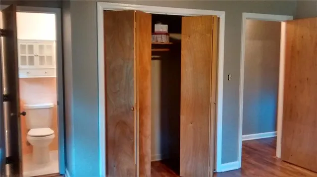 a bathroom with a shower and a toilet