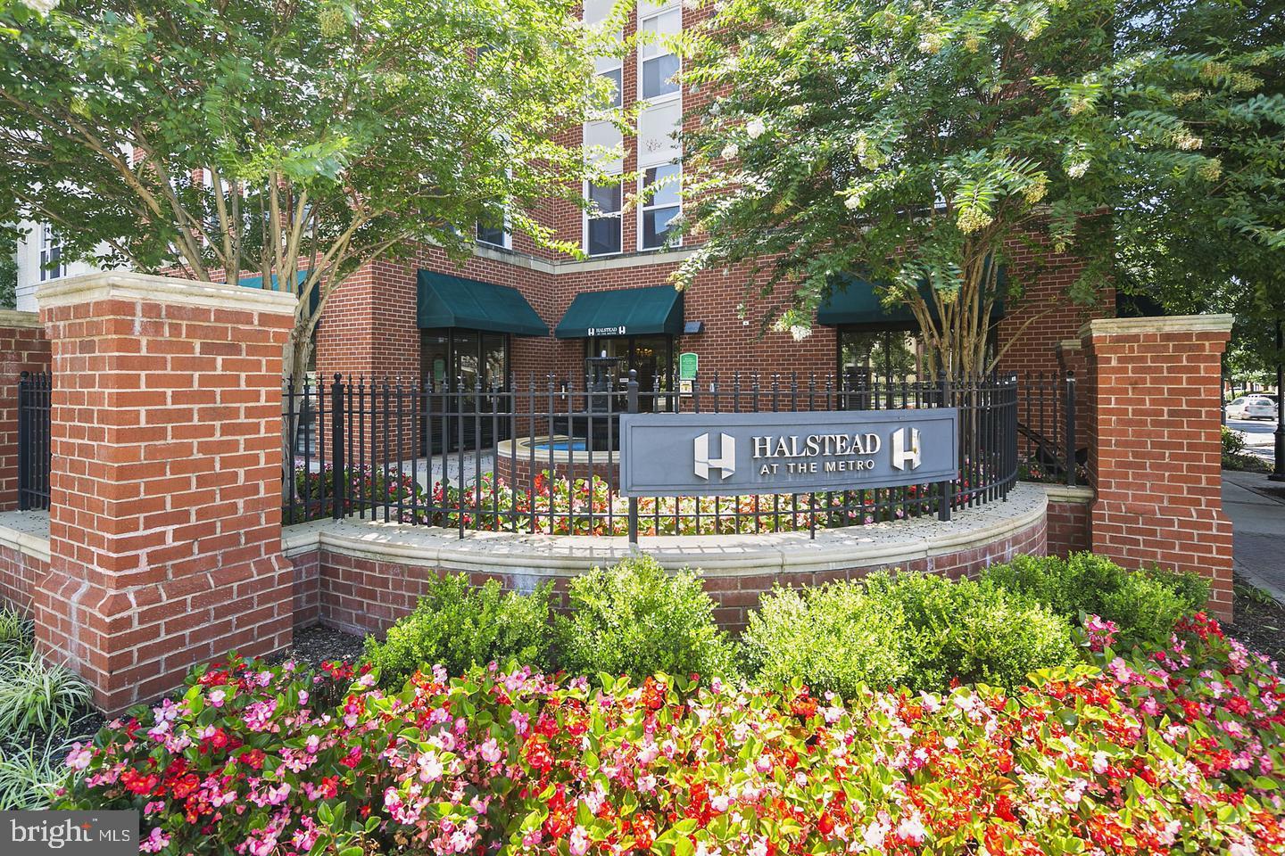 2655 Prosperity Avenue, Unit 108 Fairfax, VA 22031 - Photo 13 of 47 a view of sign board with flower plants