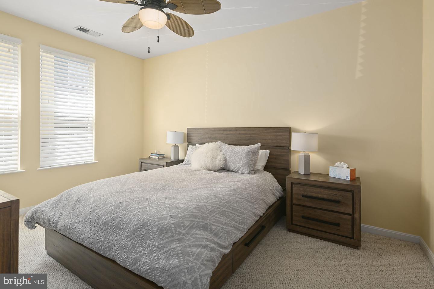 2655 Prosperity Avenue, Unit 108 Fairfax, VA 22031 - Photo 20 of 47 a bedroom with a bed and a chandelier