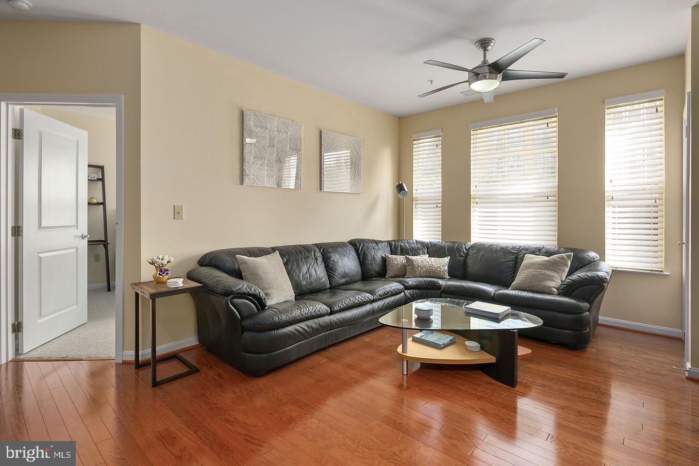 2655 Prosperity Avenue, Unit 108 Fairfax, VA 22031 - Photo 2 of 47 a living room with furniture and a large window