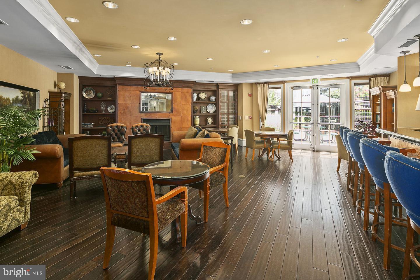 2655 Prosperity Avenue, Unit 108 Fairfax, VA 22031 - Photo 28 of 47 a view of a dining room with furniture window and wooden floor