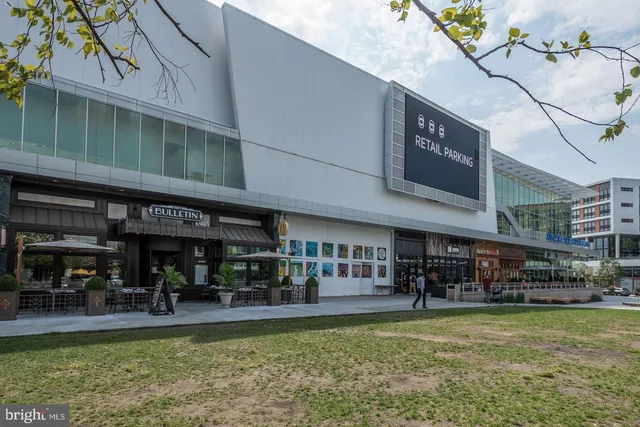 a view of a swimming pool with outdoor seating