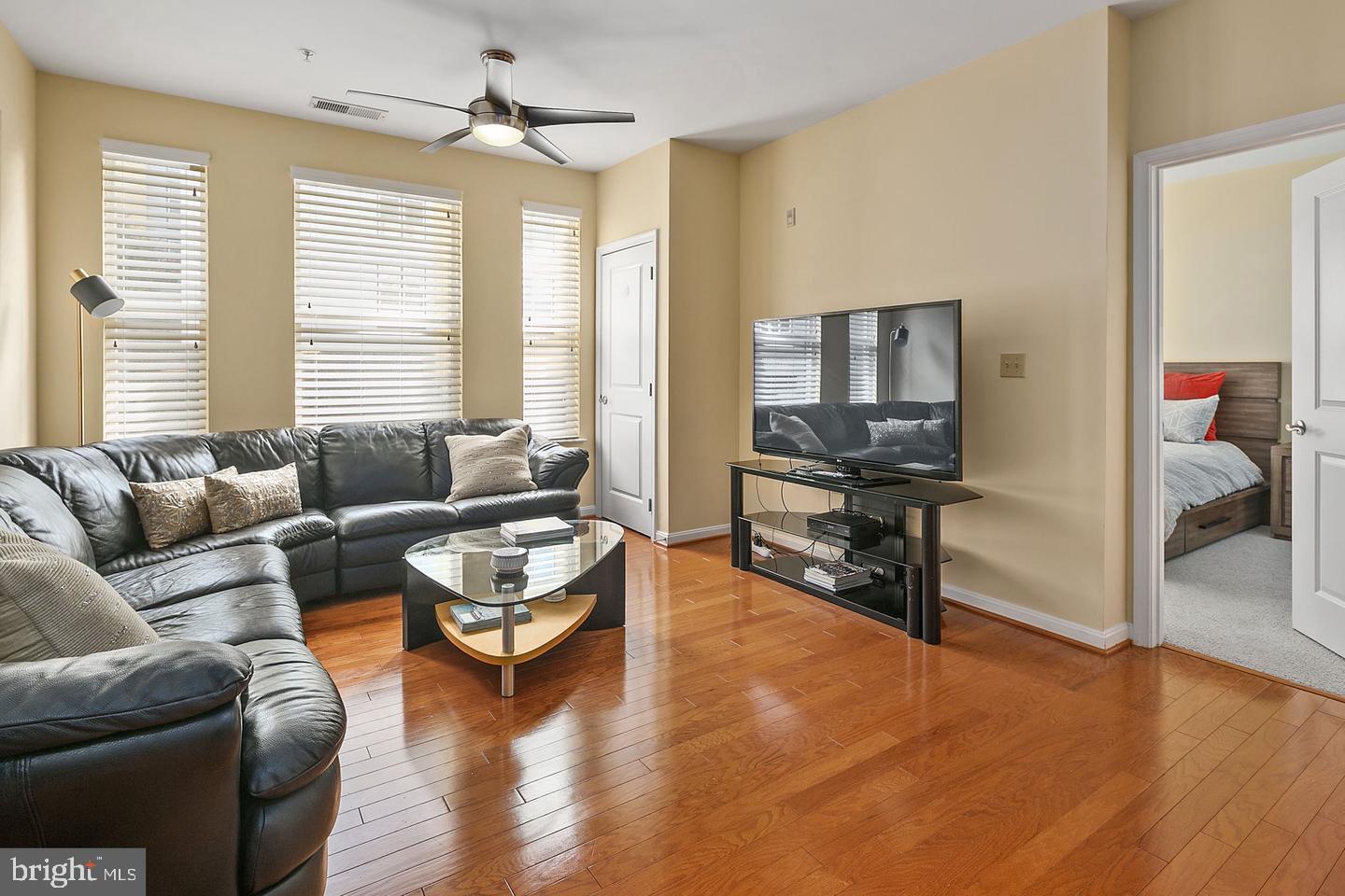 2655 Prosperity Avenue, Unit 108 Fairfax, VA 22031 - Photo 6 of 47 a living room with furniture and a window