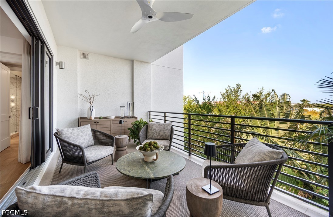 1115 Central Avenue, Unit 443 Naples, FL 34102 - Photo 30 of 40 a balcony with furniture and outdoor view